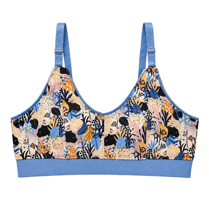 SWOOP wireless bra with light blue band and straps. Adjustable rings and sliders in the front. Print is repeating small panthers in a multi-colored floral scene.