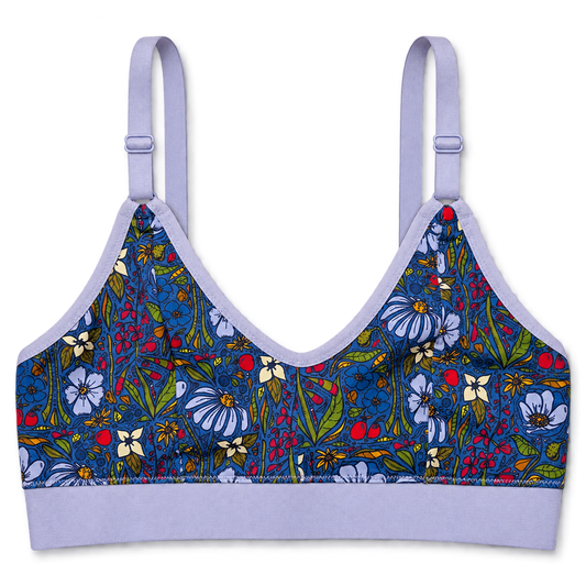 SWOOP wireless bra with a colorful floral and print on the cups and a solid light lavender trim and band, shown against a plain white background.